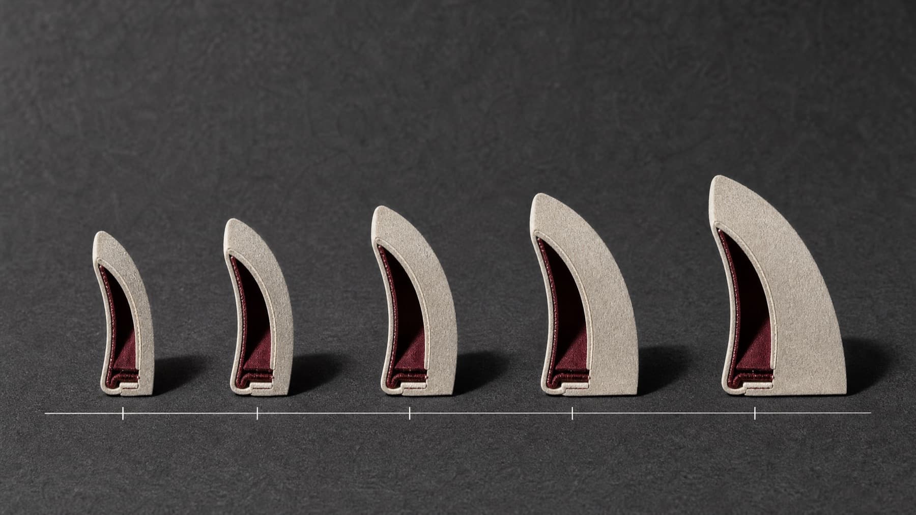 Five felt brim cross-sections standing in a row, ordered from narrow to wide