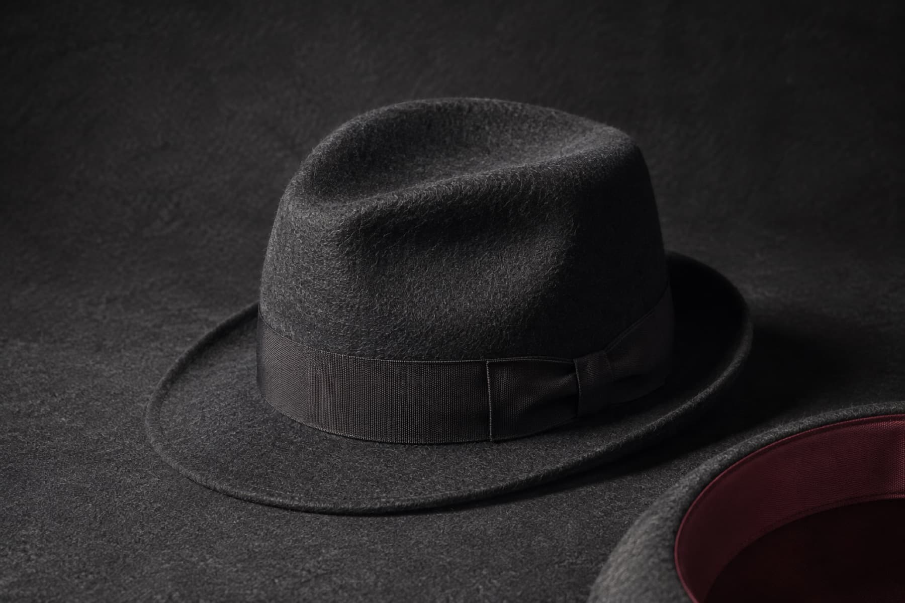 Trilby Wool 5cm: charcoal felt hat photographed whole under a single hard side light