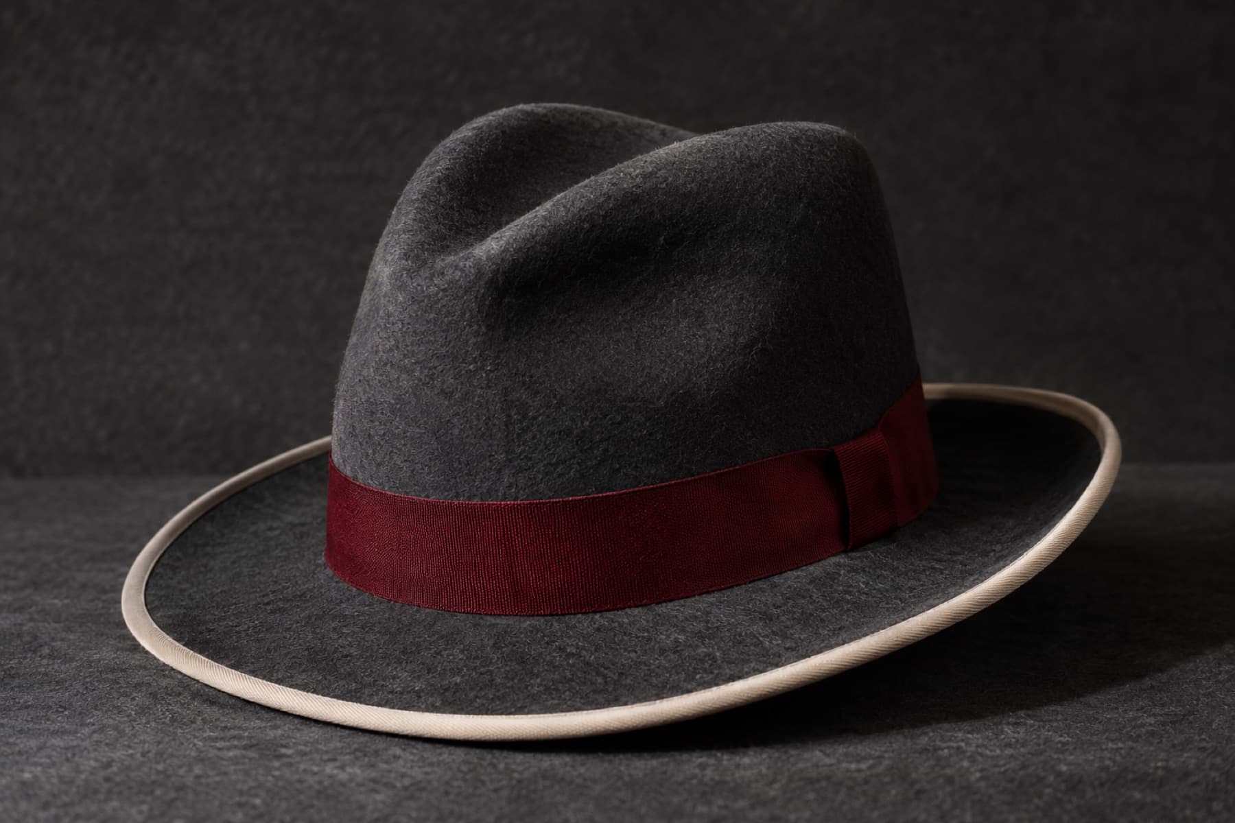 Homburg Rabbit: charcoal felt hat photographed whole under a single hard side light